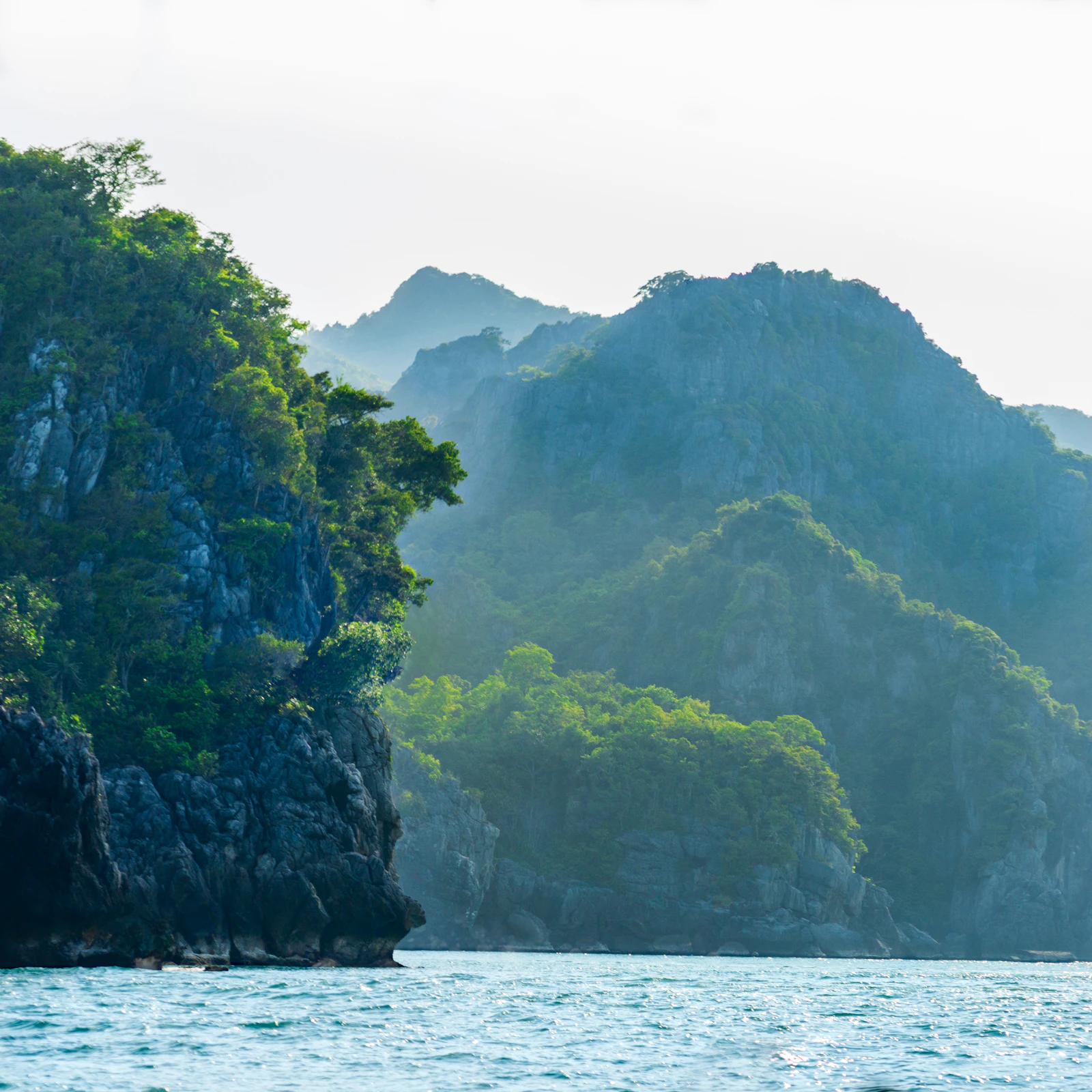 Green islands in the water of Mu Ko Ang Thong National Park