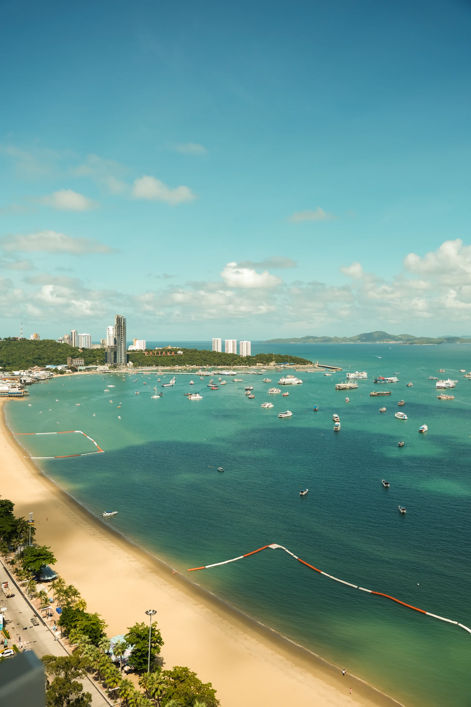 Boats on the blue sea off Pattaya's beach, seen from above