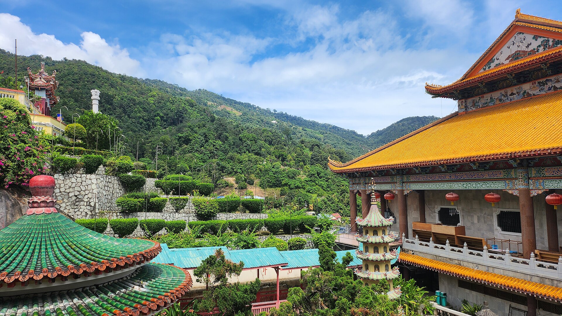 The tiled roofs, lanterns and gardens of Kek Lok Si temple on its hillside in Penang