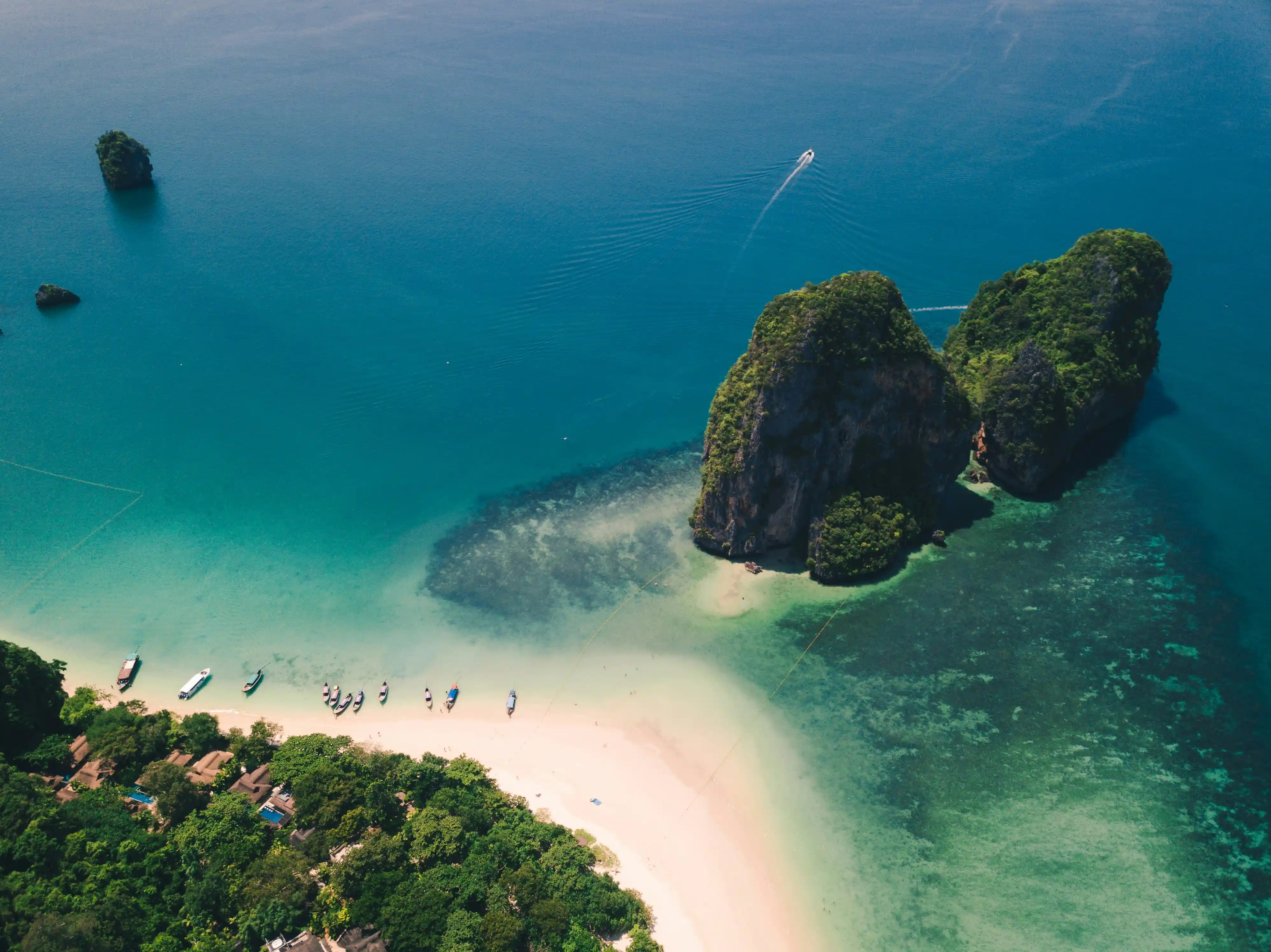 A sandbar and limestone islands in clear green water near Krabi, seen from above